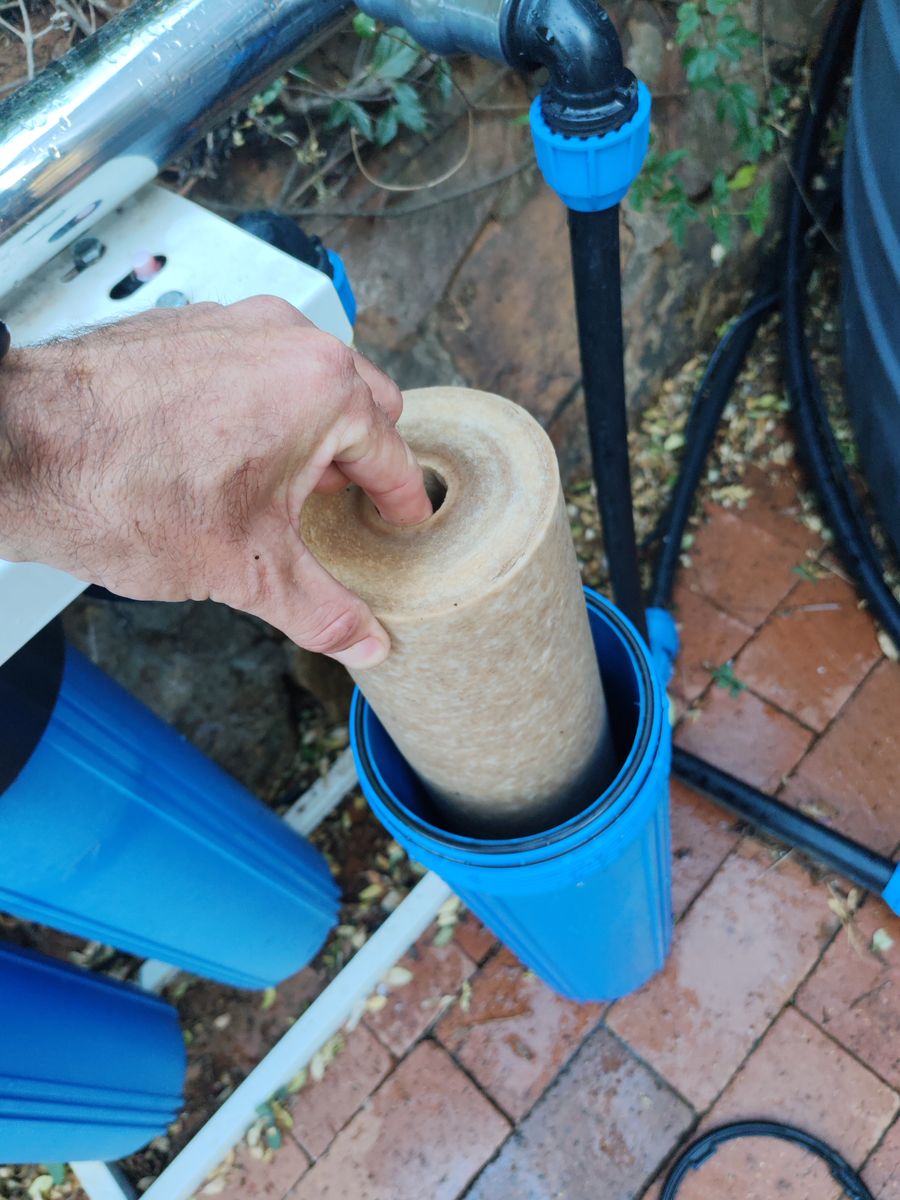 Under-sink plumbing work in Fairland kitchen