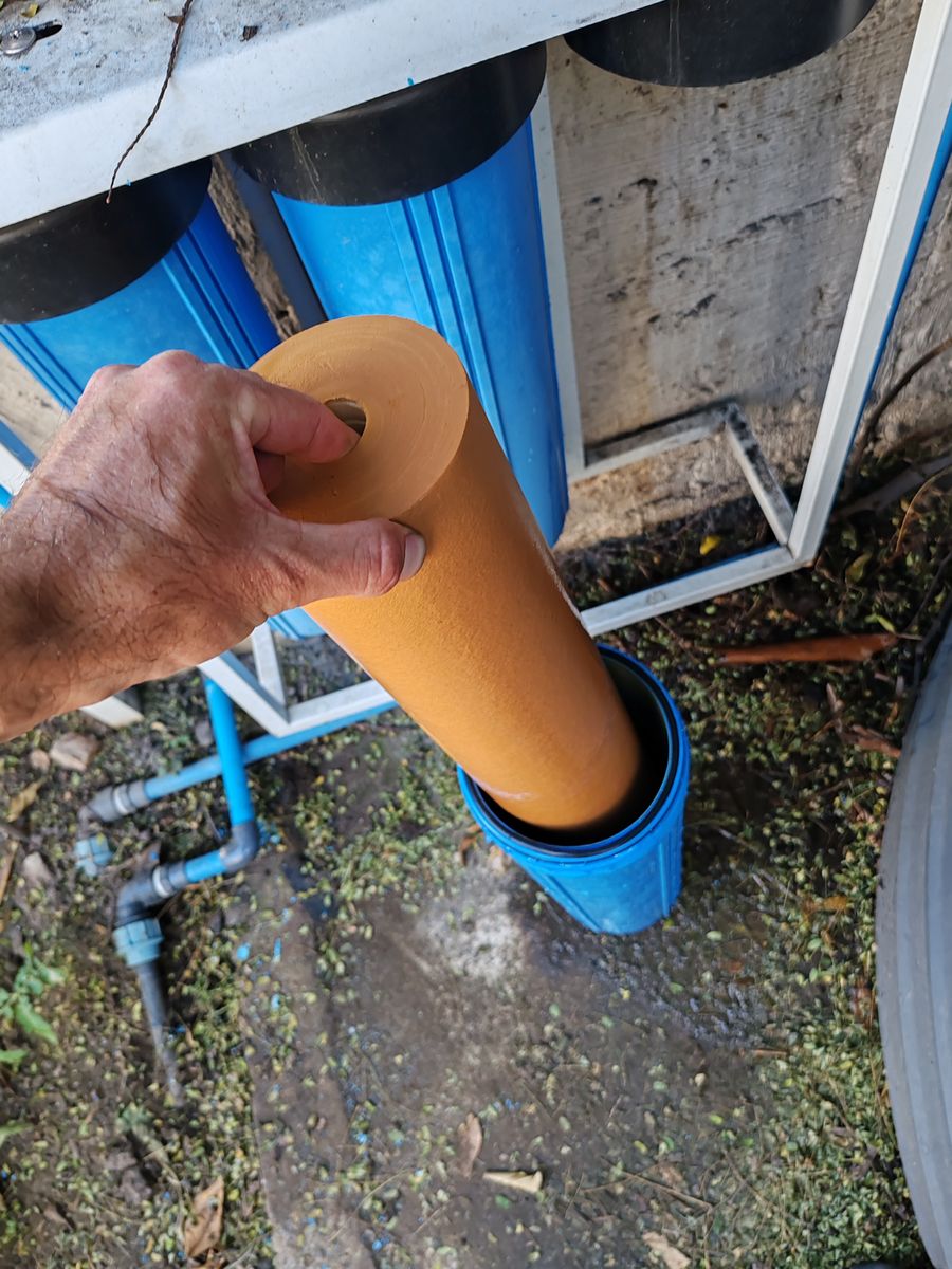 Under-sink carbon filter installation in Fairland kitchen