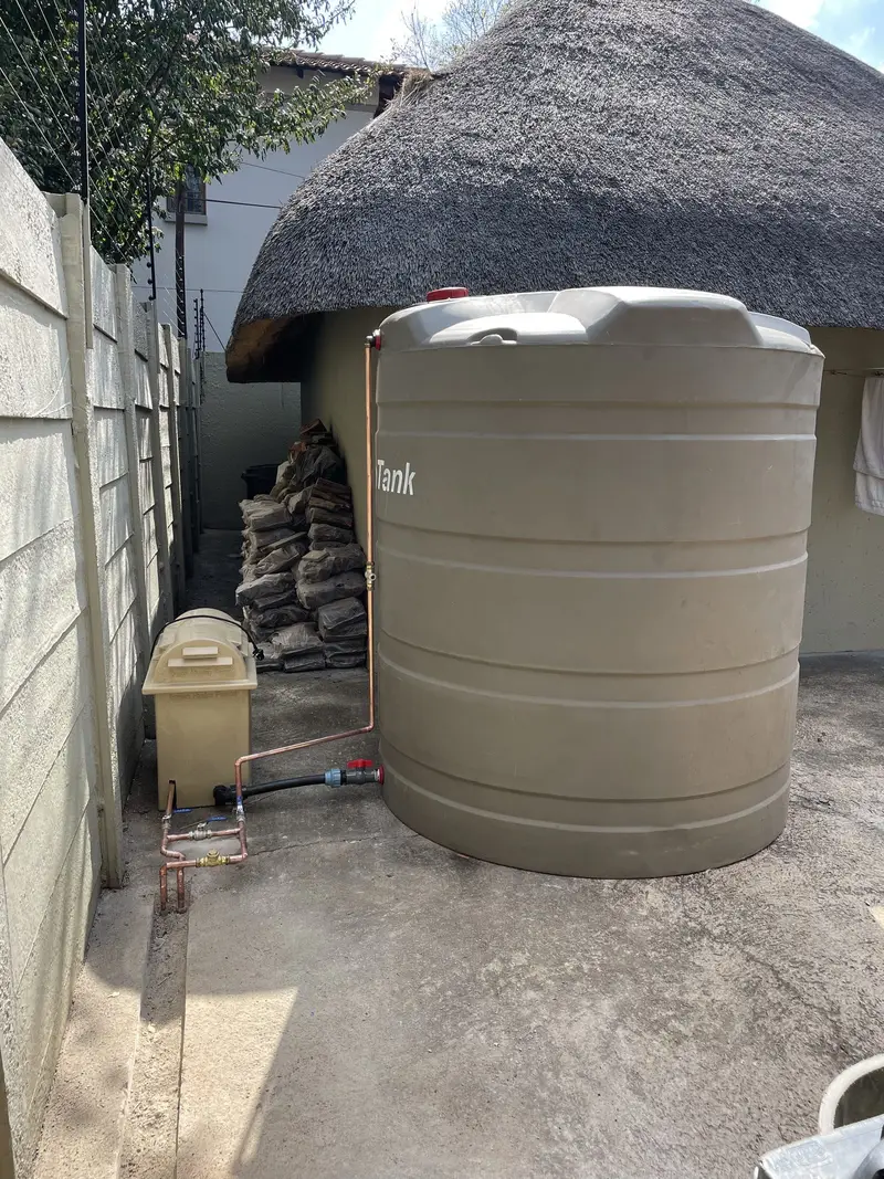 Water tank plumbing connection to house in Fairland